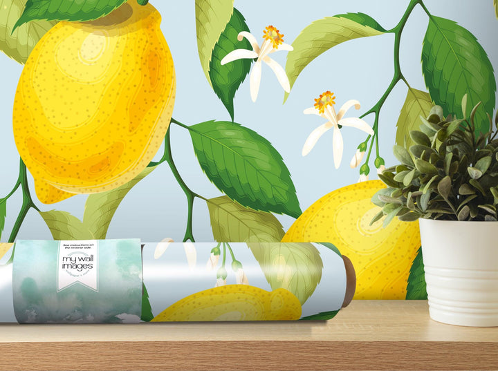 a vase with a plant and a roll of wrapping paper on a table