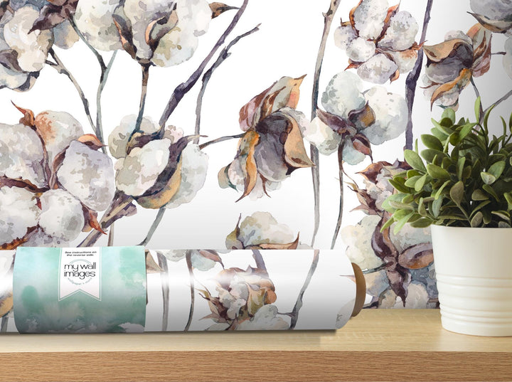 a vase of flowers sitting on top of a wooden table