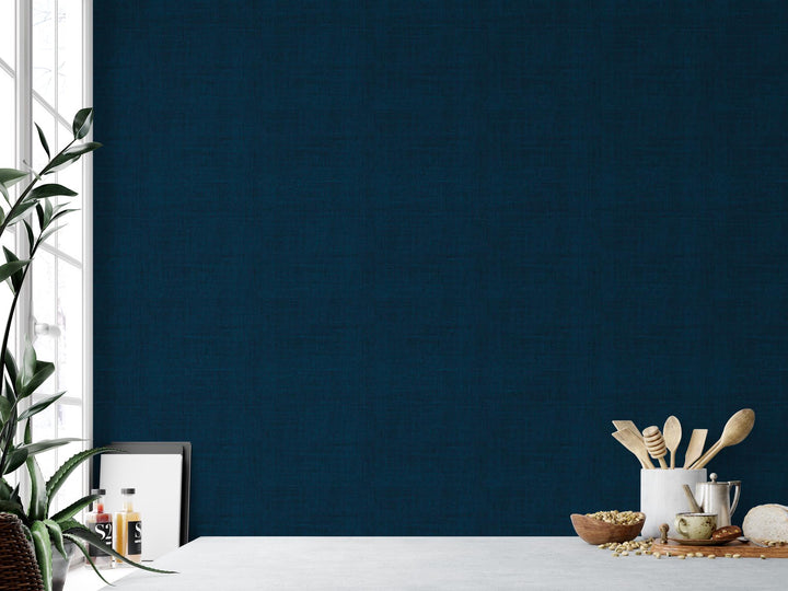 a room with a blue wall and a white table