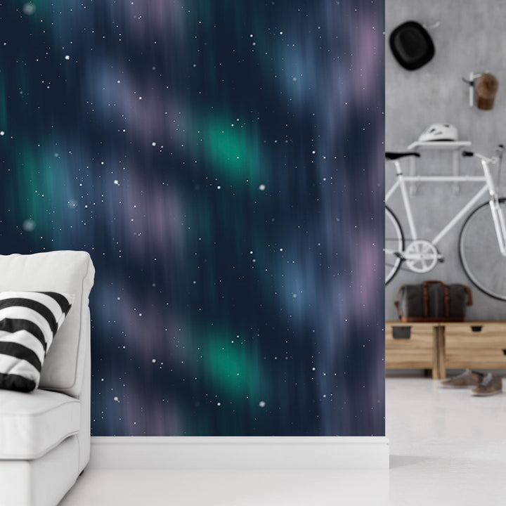 a living room with a white couch and a wall with a green and blue aurora