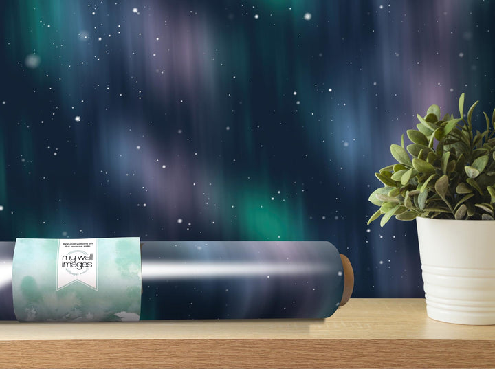 a roll of wrapping paper next to a potted plant