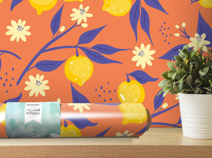 a vase with a plant next to a wallpaper
