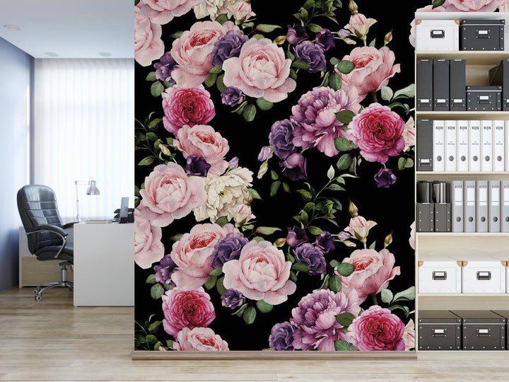a room with a book shelf and a wall with a flower pattern on it