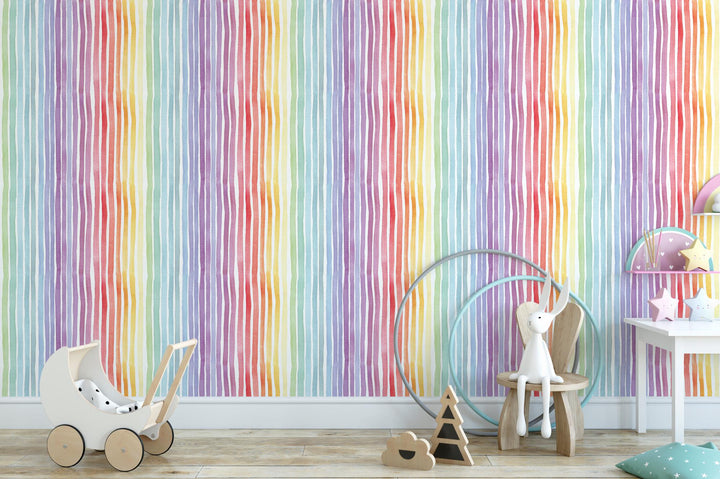 a child&#39;s room with a colorful striped wallpaper