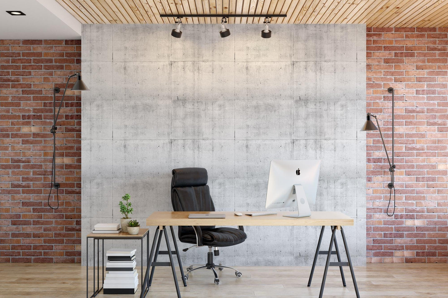 a desk with a computer on it in front of a brick wall