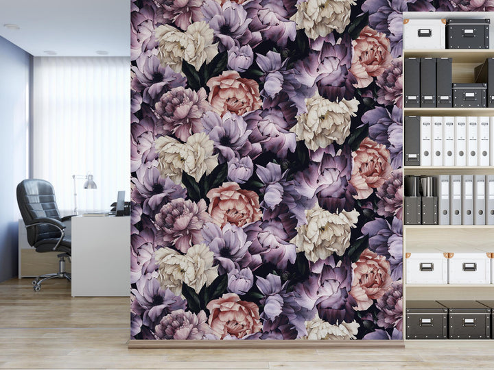 a room with a book shelf and a flowered wallpaper