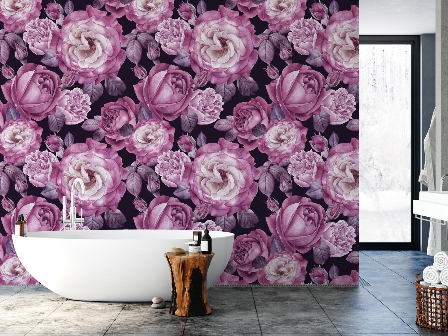 a bath tub sitting next to a wall covered in flowers