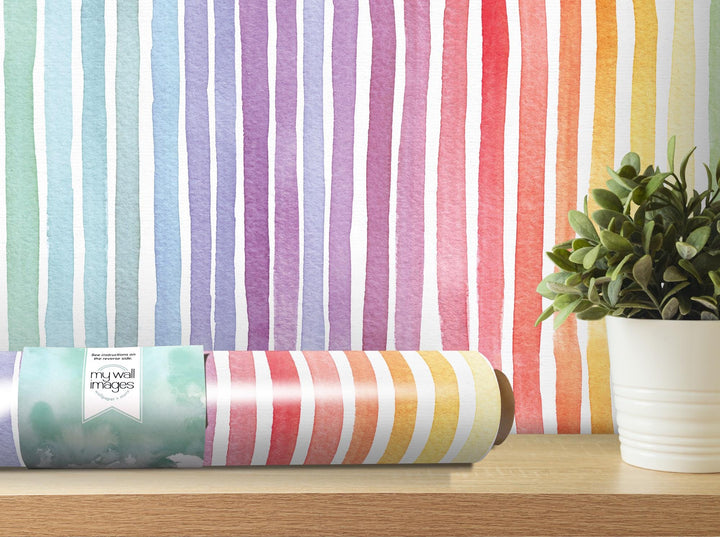 a potted plant sitting next to a roll of wrapping paper