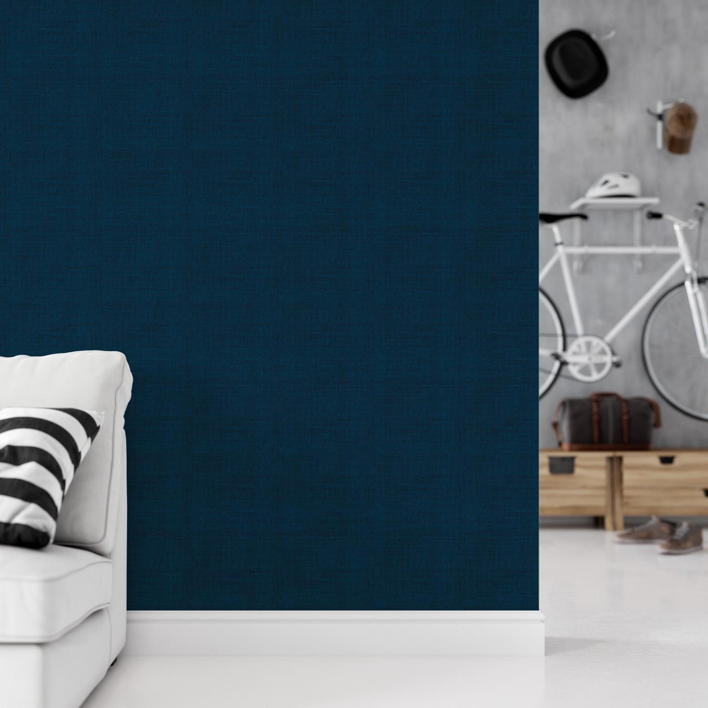 a living room with a white couch and a blue wall