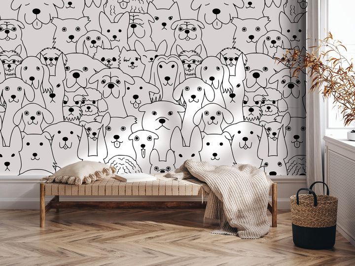 a wall mural with a large number of stylized dog faces, creating a playful and whimsical atmosphere. In the foreground, there is a bench with a blanket draped over it, and a woven basket is placed nearby. The overall scene appears to be a cozy and inviting space, with the wall mural serving as a focal point and adding a touch of whimsy to the room.