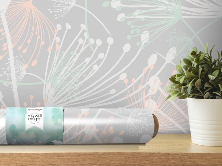 a wallpapered wall with a decorative pattern, a potted plant, and a roll of wallpaper on a shelf.