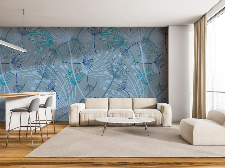 a modern living room with a large blue and white floral pattern on the wall behind a white sofa and a round coffee table. The room also includes a bar area with stools and a white chair.