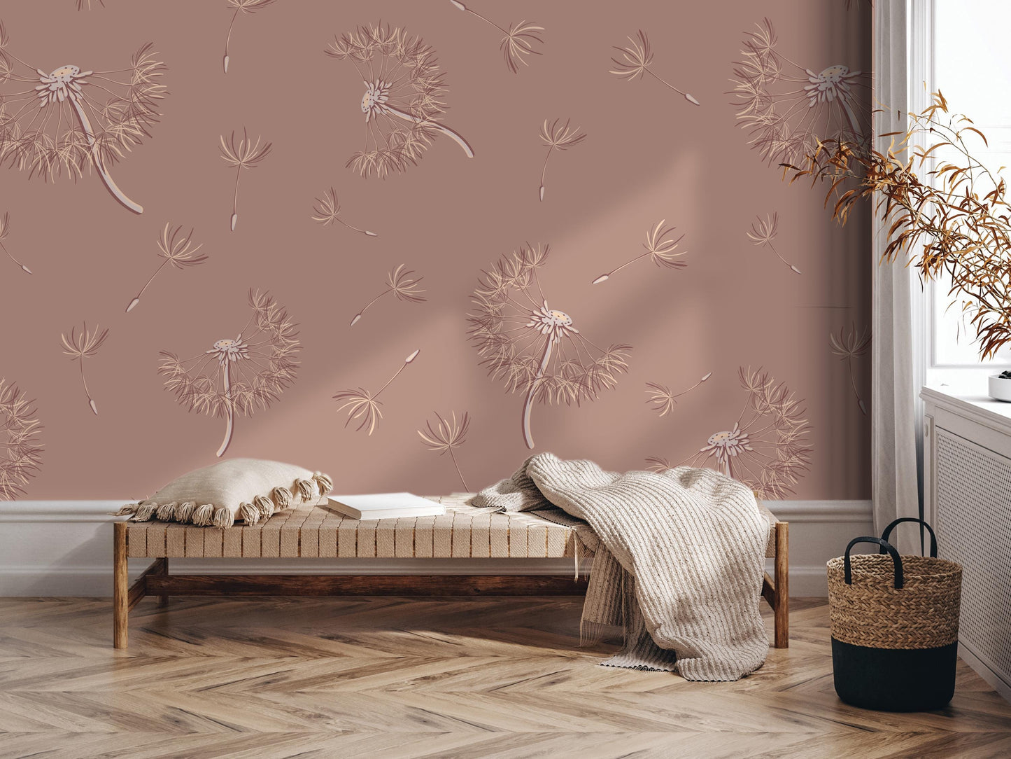 a cozy and inviting living space with a wooden floor, a bench, and a woven basket. The walls are adorned with a patterned wallpaper that includes dandelions and other floral designs. The overall atmosphere of the room is warm and inviting, with a touch of rustic charm.