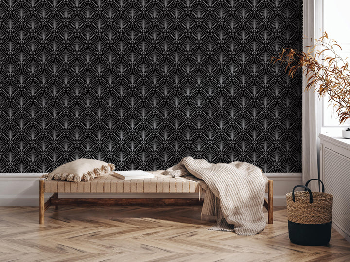 a modern and stylish interior design with a black and white patterned wallpaper, a wooden bench with a white pillow, and a woven basket on the floor.