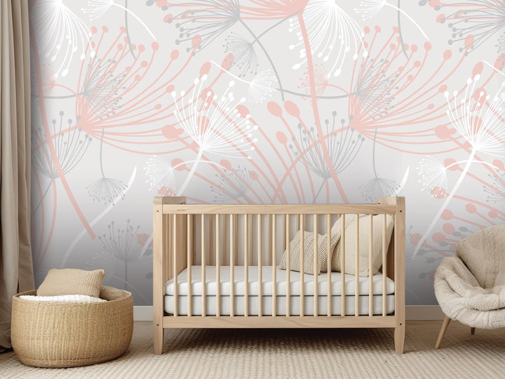 a nursery room with a wooden crib, a woven basket, and a plush chair. The walls are decorated with a floral pattern in shades of pink and gray.