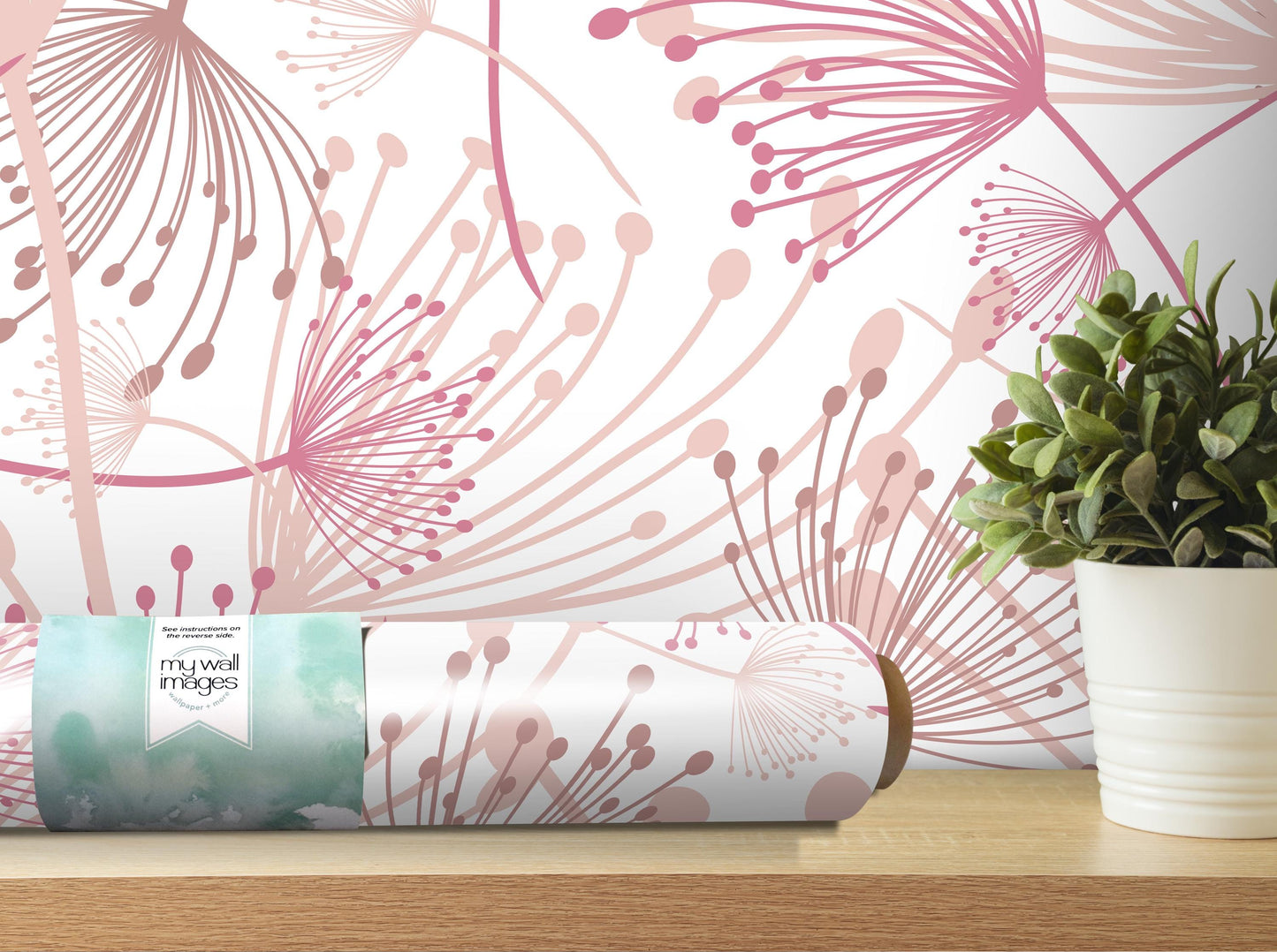a wallpapered wall with a floral pattern, a potted plant, and a roll of wallpaper on a shelf.