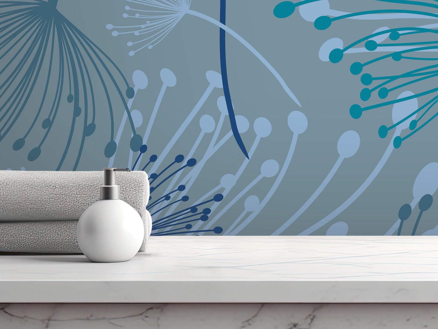 a white soap dispenser on a white marble countertop, with a folded towel and a blue and white abstract wall design in the background.