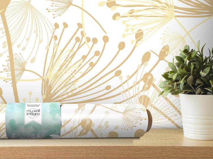 a wallpapered wall with a decorative pattern, a potted plant, and a roll of wallpaper on a shelf.