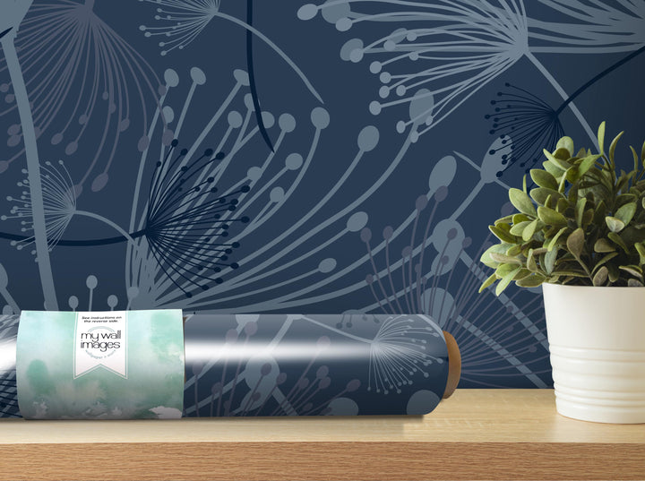 a blue wall with a pattern of white and gray lines, and a potted plant on a shelf next to it.