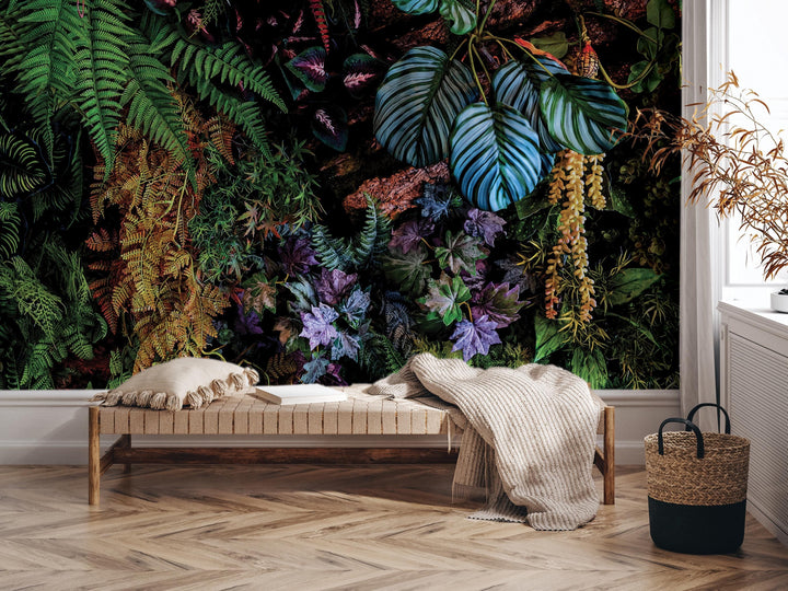 a cozy and vibrant living space with a large wall mural depicting a lush tropical garden. The room includes a wooden bench with a blanket draped over it, a woven basket, and a potted plant. The overall atmosphere is warm and inviting, with the mural serving as a focal point in the room.