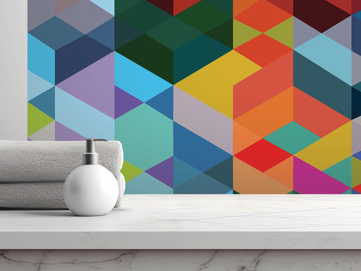 a white soap dispenser on a white countertop, with a colorful geometric pattern in the background.