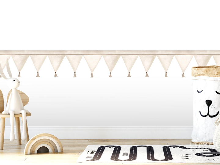 A white rabbit sits on a wooden chair in a room with a white wall, a rug, and a toy car.
