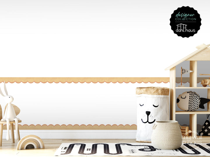 A child&#39;s bedroom with a wooden playhouse, a toy rabbit, and a toy fish. The room has a white and beige color scheme, and there is a large window with a scalloped trim.